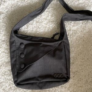 OGIO cross body or over the shoulder purse. Charcoal gray.